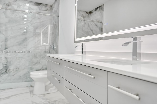 bathroom with toilet, marble finish floor, a marble finish shower, and vanity