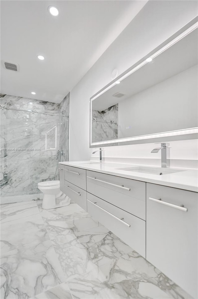 full bath with a marble finish shower, recessed lighting, visible vents, toilet, and vanity