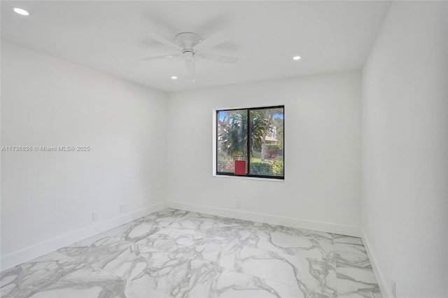 spare room with marble finish floor, baseboards, a ceiling fan, and recessed lighting