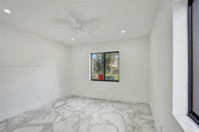 empty room with marble finish floor, recessed lighting, a ceiling fan, and baseboards