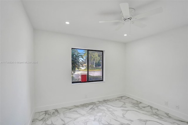 unfurnished room featuring ceiling fan, marble finish floor, recessed lighting, and baseboards