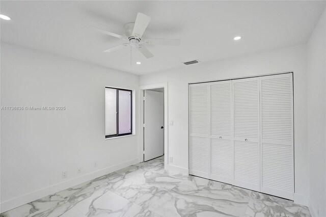 unfurnished bedroom featuring baseboards, a closet, visible vents, and recessed lighting