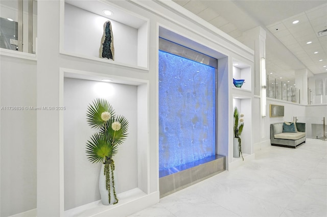 foyer entrance featuring recessed lighting, marble finish floor, and visible vents