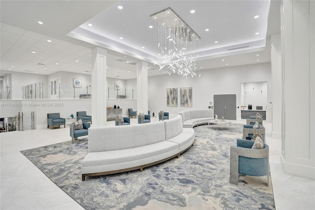 living room featuring recessed lighting, marble finish floor, a raised ceiling, and visible vents