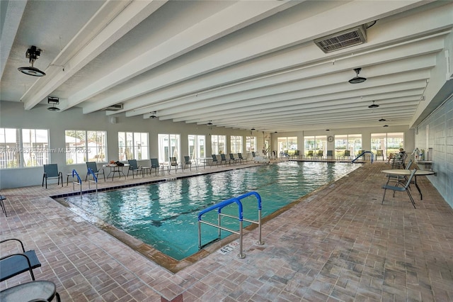 community pool with a patio area