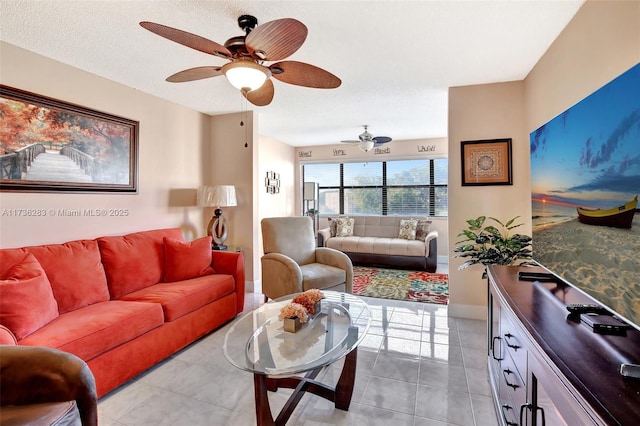 tiled living room with ceiling fan and a textured ceiling