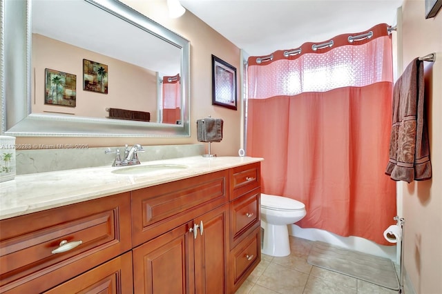 bathroom featuring vanity, tile patterned flooring, toilet, and walk in shower