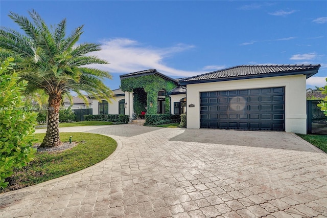 mediterranean / spanish-style house featuring a garage