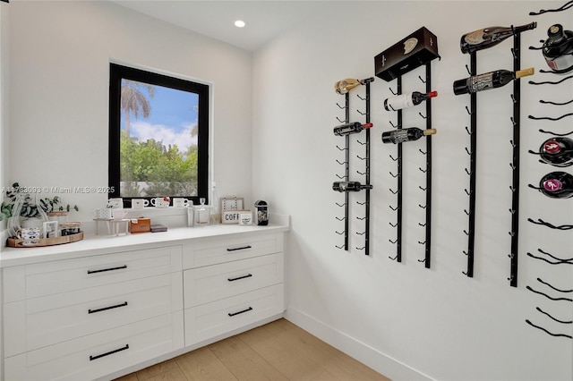 bathroom featuring hardwood / wood-style flooring and vanity