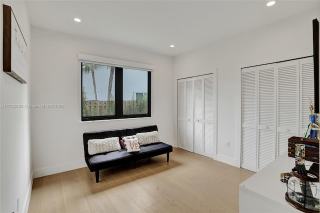 sitting room with hardwood / wood-style floors