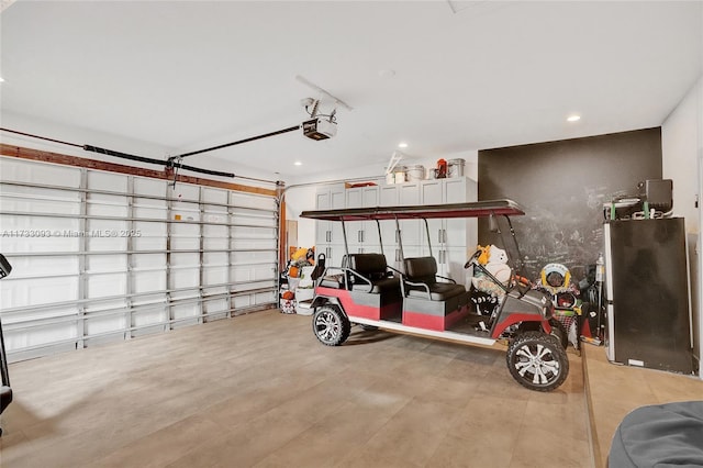 garage featuring a garage door opener and stainless steel refrigerator