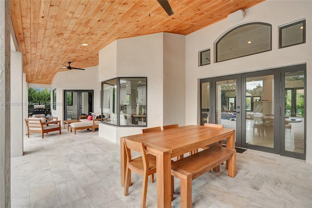 view of patio featuring an outdoor living space, french doors, and ceiling fan