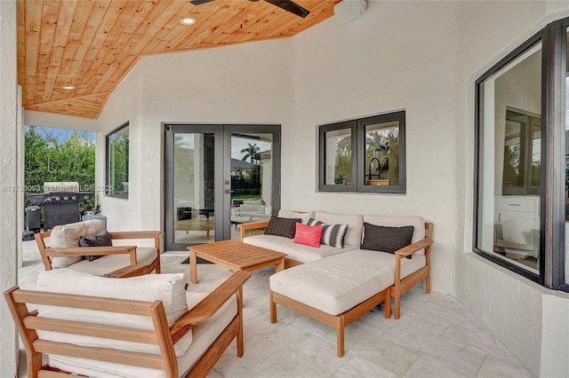 view of patio featuring french doors, ceiling fan, an outdoor hangout area, and area for grilling