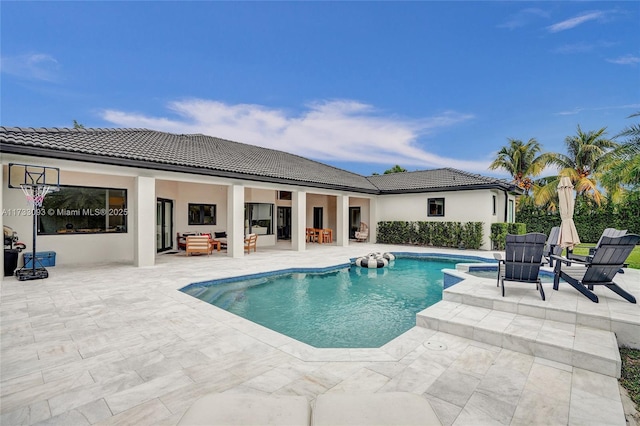 view of pool featuring a patio area