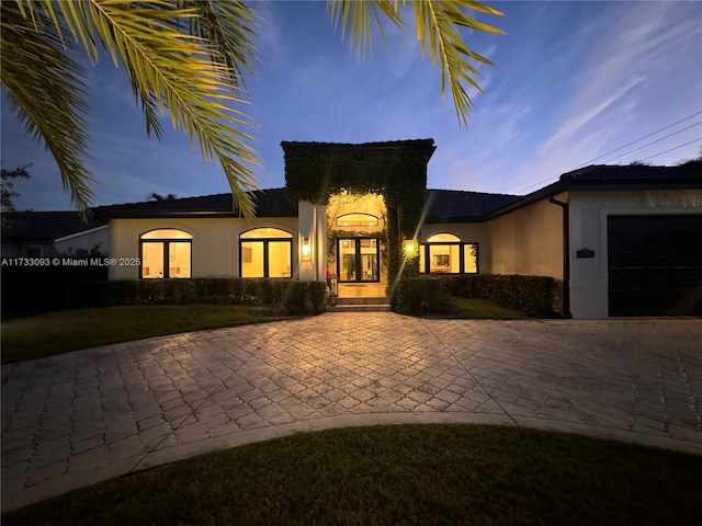 view of front of home with a garage