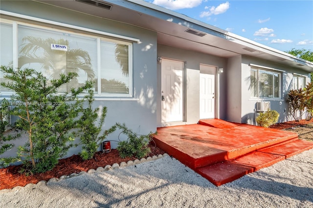 entrance to property with a deck