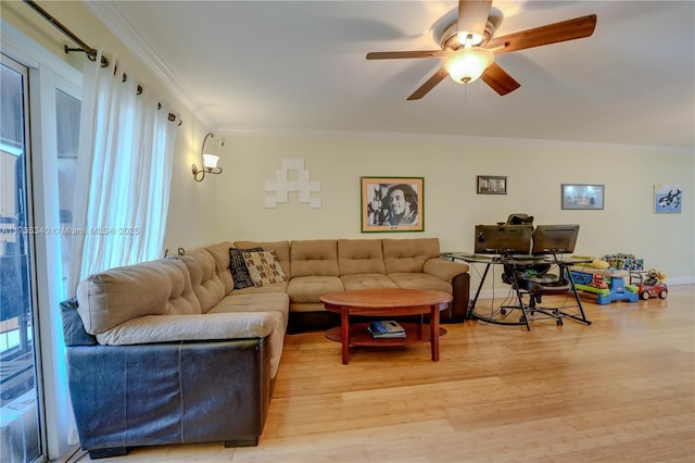 living room with ceiling fan, ornamental molding, and wood-type flooring