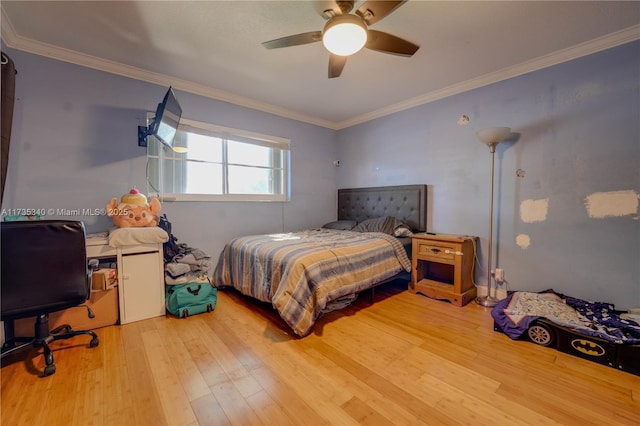 bedroom with wood-type flooring, ornamental molding, and ceiling fan