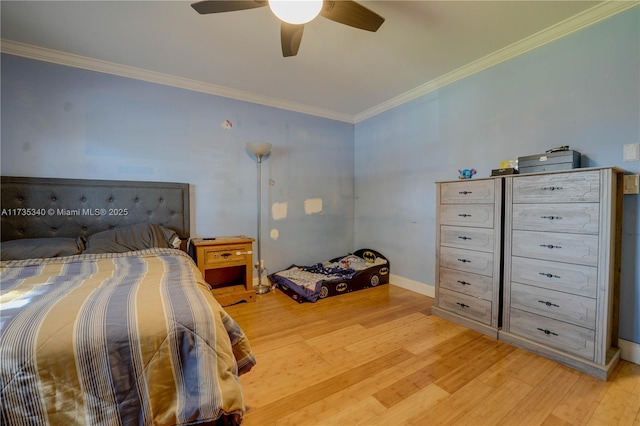 bedroom featuring crown molding, ceiling fan, and light hardwood / wood-style flooring