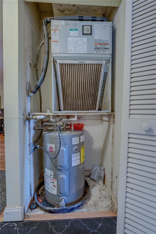 utility room with electric water heater