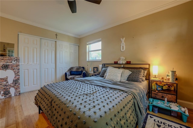 bedroom with crown molding, a closet, ceiling fan, and light wood-type flooring