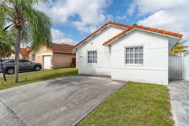 view of side of home featuring a yard