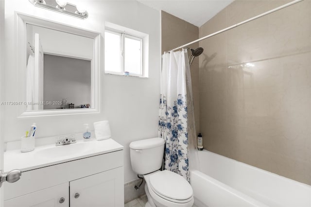 full bathroom featuring vanity, shower / bath combo with shower curtain, and toilet