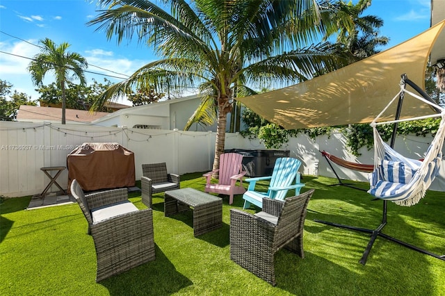 view of yard with a hot tub