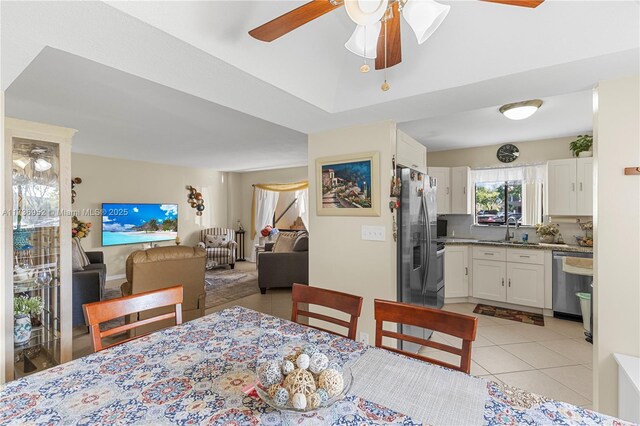 bedroom with french doors, ceiling fan, light tile patterned floors, and access to outside