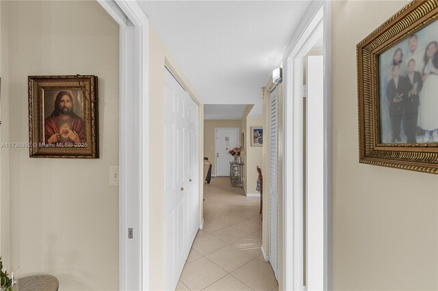 hallway with light tile patterned floors