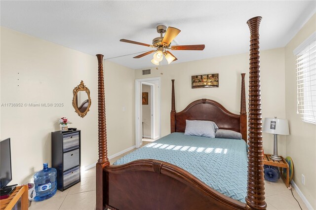 tiled bedroom with ceiling fan