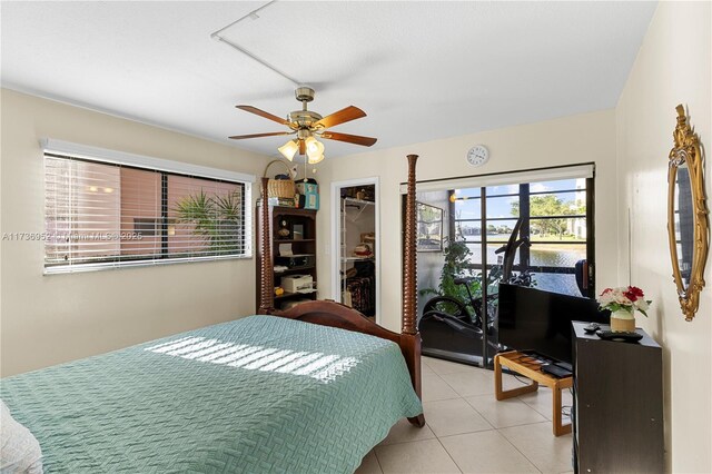 bedroom with light tile patterned floors and ceiling fan