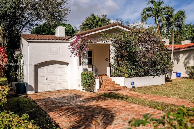 mediterranean / spanish-style house featuring a garage