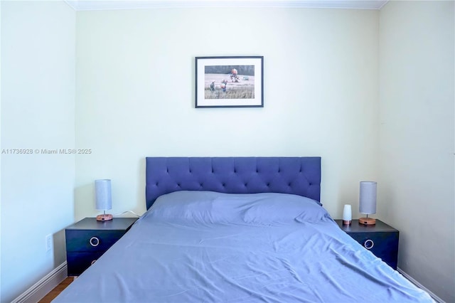 bedroom with crown molding