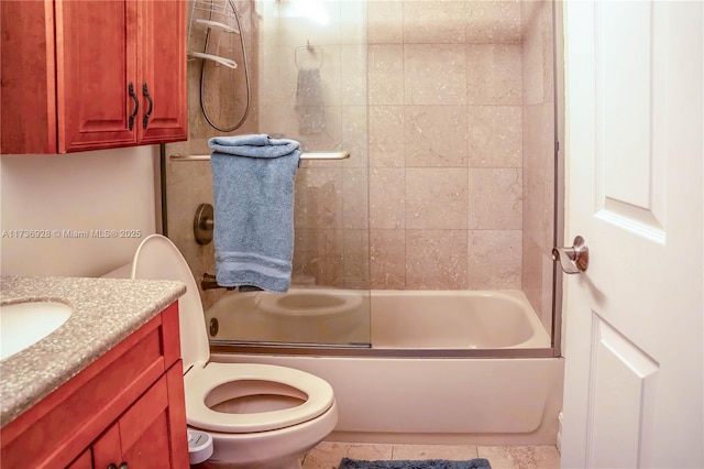 full bathroom with vanity, toilet, and combined bath / shower with glass door