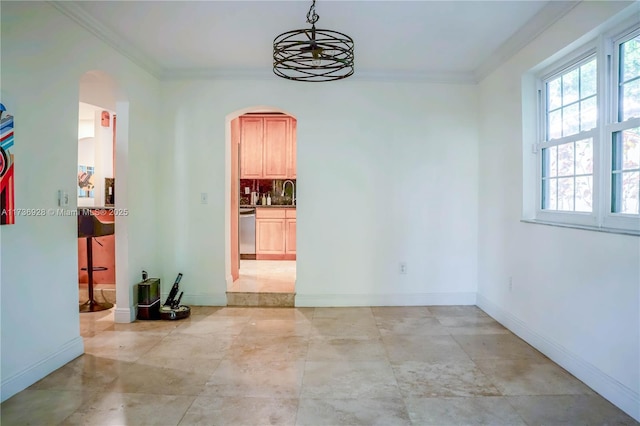 spare room with sink and ornamental molding