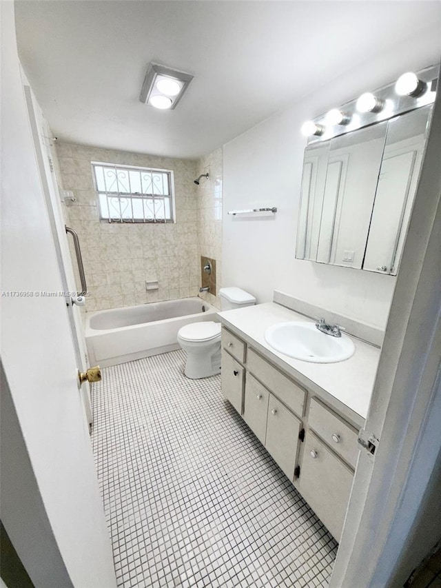 bathroom with shower / bathing tub combination, vanity, toilet, and tile patterned floors