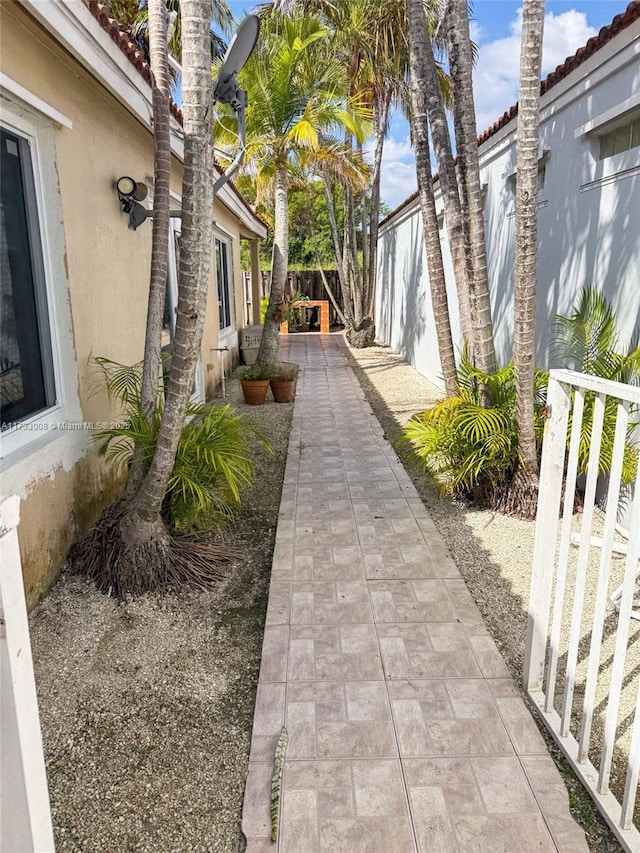 view of side of property featuring a patio area