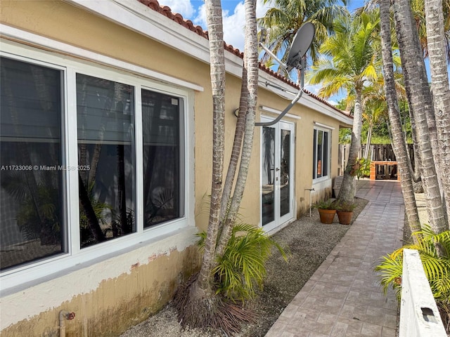 view of side of property with a patio