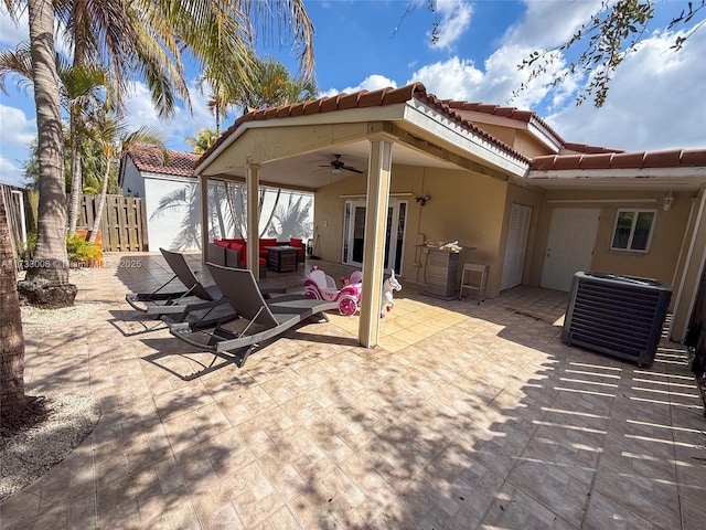 view of patio with cooling unit and ceiling fan