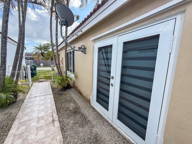 view of side of property featuring french doors