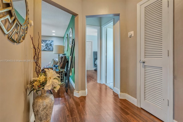 hall featuring dark wood-type flooring