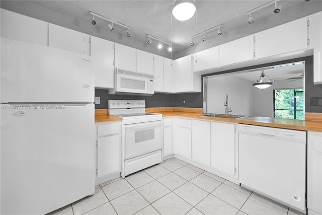 kitchen featuring white cabinetry, sink, white appliances, and a textured ceiling