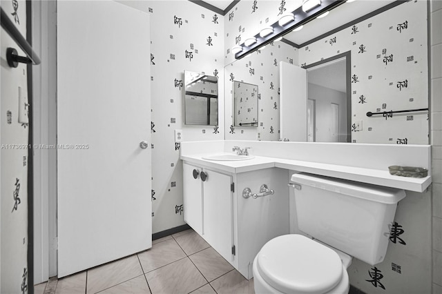 bathroom with tile patterned floors, vanity, and toilet