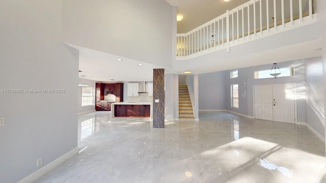 entryway with a towering ceiling