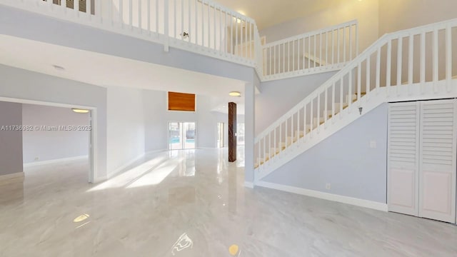 interior space featuring a towering ceiling