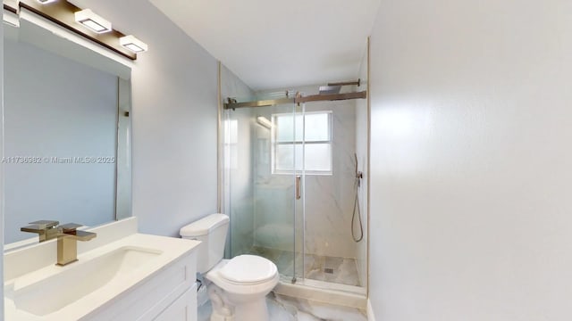 bathroom featuring walk in shower, vanity, and toilet