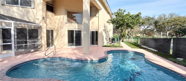 view of swimming pool with a patio