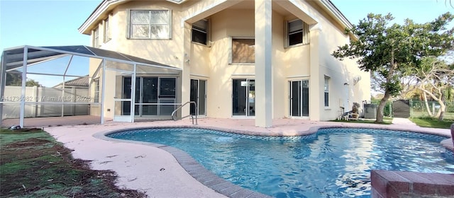 rear view of property with a patio, a fenced in pool, glass enclosure, and central air condition unit