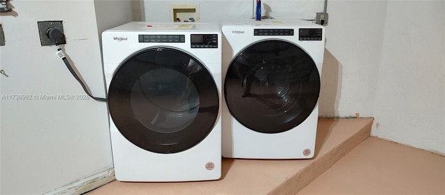 clothes washing area featuring washing machine and dryer